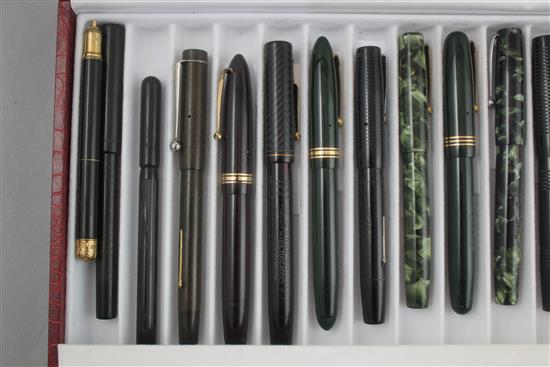 A collection of twenty Mabie Todd Swan fountain pens and a similar ejector pencil,